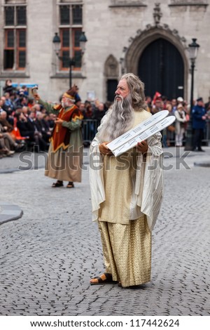 BRUGES, BELGIUM - MAY 17: Annual Procession of Holy Blood on Ascension Day. Locals perform  dramatizations of Biblical events - Moses with Ten Commandments. May 17, 2012 in Bruges (Brugge), Belgium