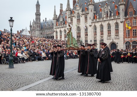 BRUGES, BELGIUM - MAY 17: Annual Procession of the Holy Blood on Ascension Day. Locals carry statue of the Virgin Mary. May 17, 2012 in Bruges (Brugge), Belgium