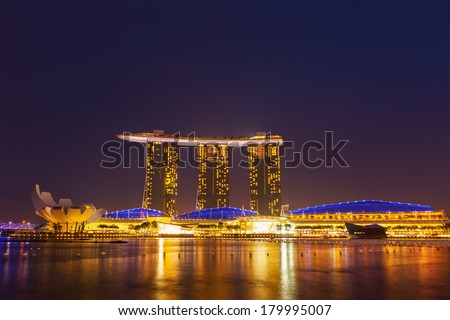 SINGAPORE - JANUARY 1, 2014,  : The Marina Bay Sands complex in the night -  Marina Bay Sands is an integrated resort and billed as the world\'s most expensive standalone casino property