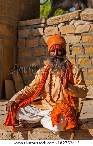 JAISALMER, INDIA - NOVEMBER 28, 2012: Indian sadhu (holy man) blessing. Sadhus are holy men who live ascetic life and focus on spiritual practice of Hinduism