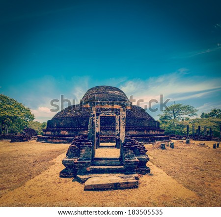 Vintage retro hipster style travel image of ancient Buddhist dagoba (stupe) Pabula Vihara. Ancient city of Pollonaruwa, Sri Lanka