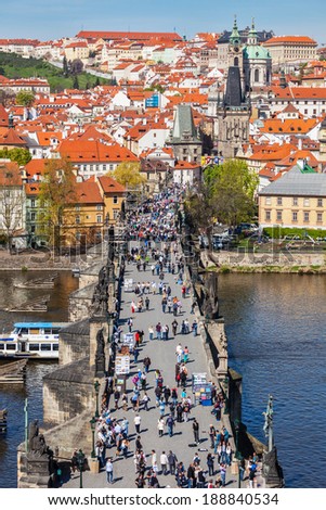 PRAGUE, CZECH REPUBLIC - APRIL 26, 2012:  Charles Bridge over Vltava river crowded with tourists in Prague, Czech republic