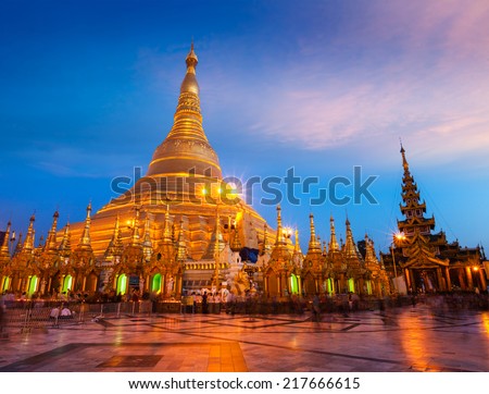 Myanmer famous sacred place and tourist attraction landmark - Shwedagon Paya pagoda illuminated in the evening. Yangon, Myanmar (Burma)