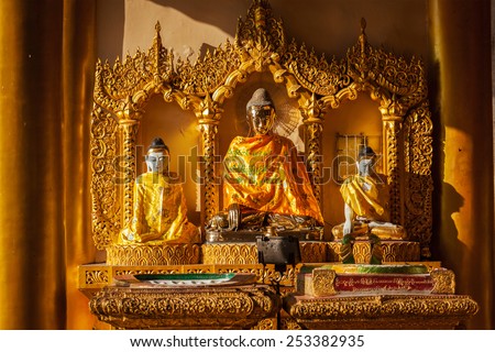 Buddha statues in Burma famous sacred place and tourist attraction landmark - Shwedagon Paya pagoda. Yangon, Myanmar