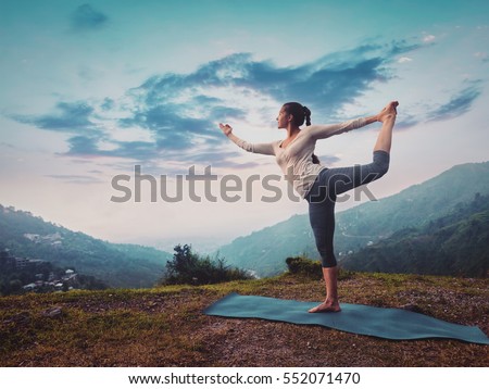 Similar – Image, Stock Photo Tranquil woman with retro lamp in dark room