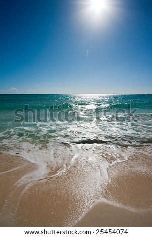 Beautiful beach, sun and waves of Caribbean Sea. Please search for other beach images in my portfolio - there are lots of them.