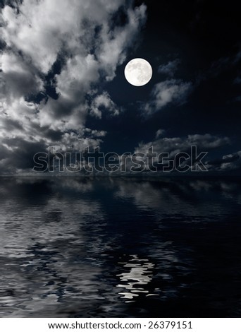 Moon and clouds above sea at night photo