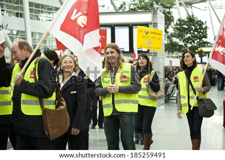 Dusseldorf Airport, Dusseldorf, Germany:  March 21, 2013. Queues of people form in front of check in desks due to a strike in Dusseldorf airport.Lufthansa employees on strike.