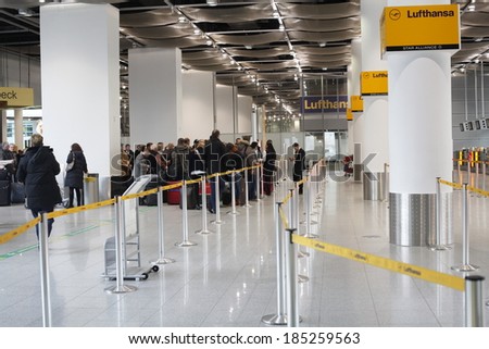 Dusseldorf Airport, Germany:March 21, 2013. Queues of people form in front of check in desks due to a strike in Dusseldorf airport.Lufthansa employees on strike.
