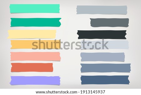 Grey, blue, yellow and green different size adhesive, sticky, masking, duct tape, paper pieces are on white background