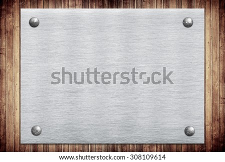 Metal sign, name plate on wooden wall planks