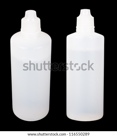 Two white plastic semitransparent containers filled by a liquid isolated on black