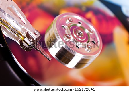 Hard drive red and yellow mirror surface with reading writing head