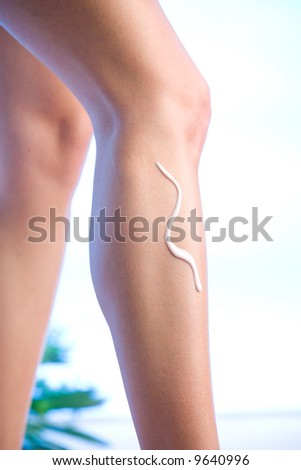 a womans leg with body lotion applied