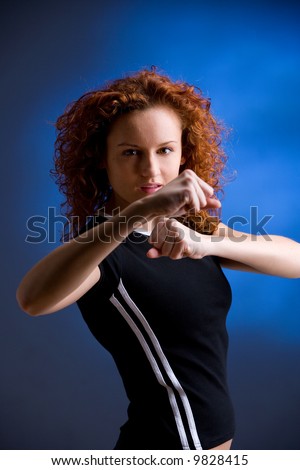 young sporty woman is practicing martial arts