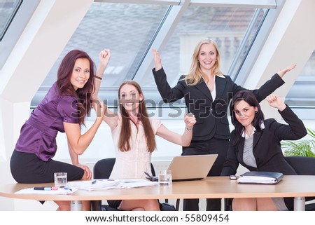 female boss and her workers are excited of their results