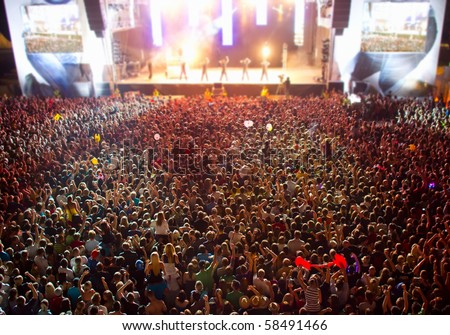 big crowd before stage at a live concert of a famous rockband