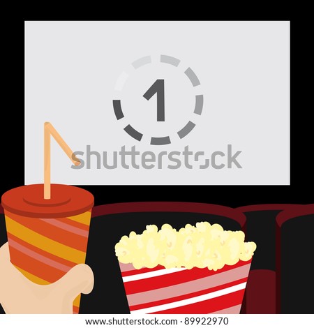 With popcorn and drink in the cinema