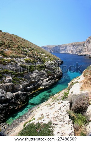 A colourful inlet on the coast of Gozo, one of the Maltese islands in the Mediterranean