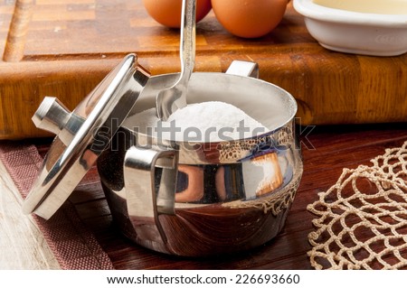 metal sugar bowl with teaspoon