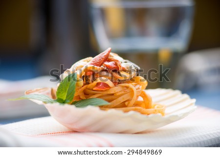 Spaghetti with seafood served in a shell