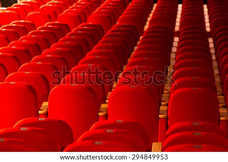 empty red chairs in a theater or cinema