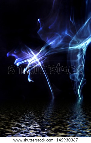 Blue smoke reflected in water surface.