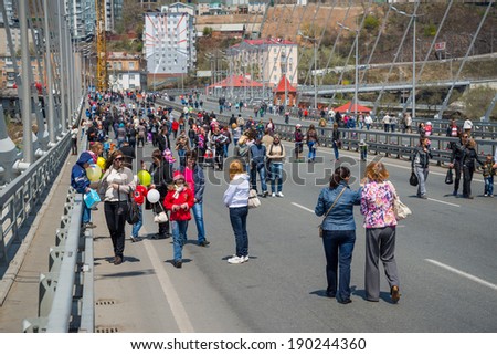VLADIVOSTOK, RUSSIA - MAY 1, 2014: Citizens walk on \