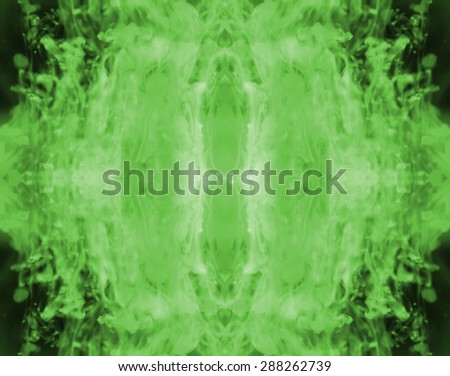Green ink forming patterns resembling Rorschach Test ink blots.