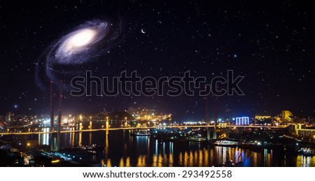 City landscape at night with sky with stars and galaxy.