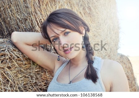 Beautiful polish girl on haystack background