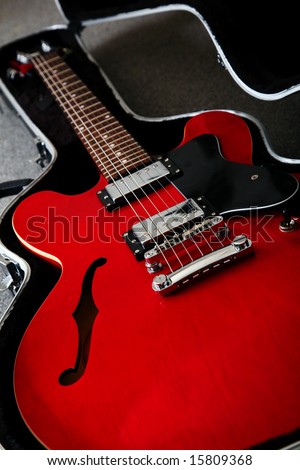 A red 1950\'s electro acoustic guitar