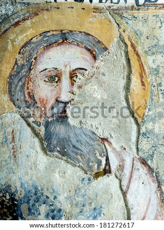 AGLIATE, ITALY - FEBRUARY 22, 2014: painting by anonymous medieval artist in the Baptistery of Saints Peter and Paul in Agliate on February 22th 2014. This church was built in 10th century.