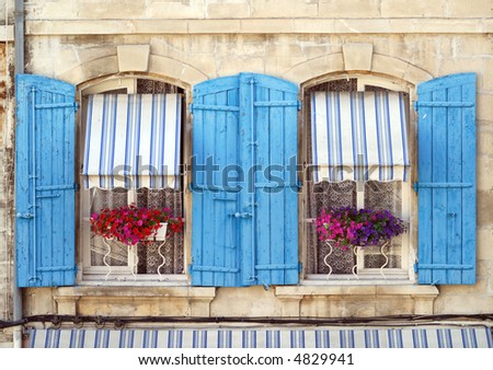 Arles (Provence, France) - Two windows of a house in front of Les Arenes