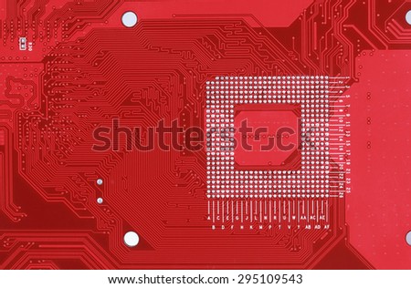 Red circuit board texture background close-up of computer motherboard