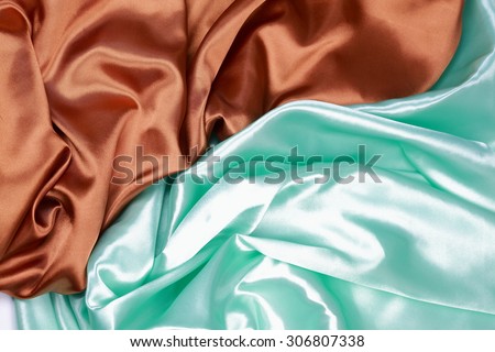 Brown and light green silk texture satin velvet material or elegant wallpaper design curve folds wavy background