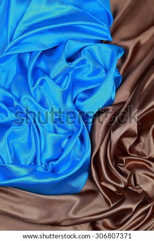 Blue and brown silk texture satin velvet material or elegant wallpaper design curve folds wavy background