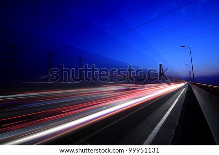 View City-highway vehicles in the evening rainbow light trails