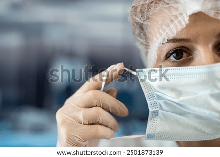 Similar – Image, Stock Photo Worker putting white face mask