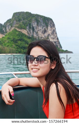 A beautiful young woman smile on speed boat, Krabi Thailand