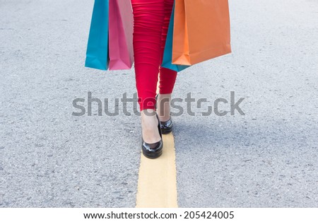High Heels Girl  With Shopping Bags Walking On Street