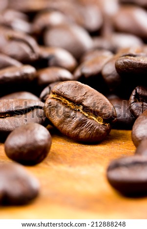 Coffee on wooden background Fresh coffee beans on wood ,ready to brew delicious coffee