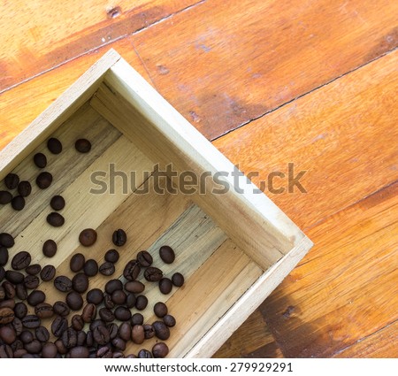 coffee beans in wood box on wood
