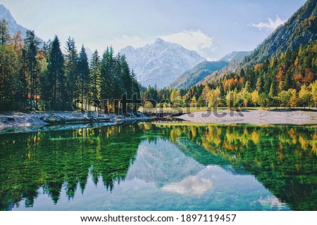 Similar – Foto Bild Ruhiger See und Berge bei Sonnenuntergang