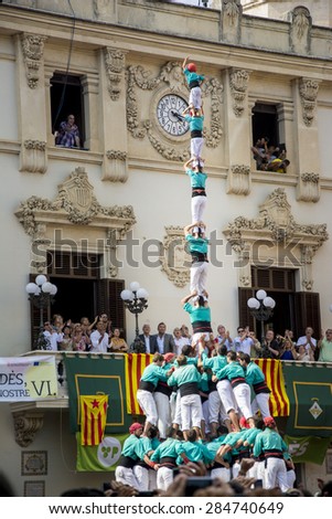 VILAFRANCA, SPAIN - AUGUST 30, 2014: Castells Performance, a castell is a human tower built traditionally in festivals within Catalonia. This is also on the UNESCO Intangible Cultural Heritage