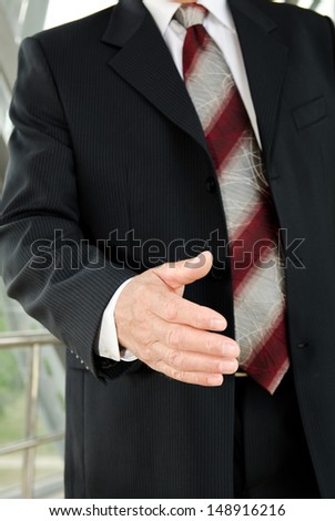 Businessman male hand reached to seal the agreement on business background