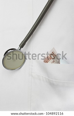 money in the doctor\'s pocket close up