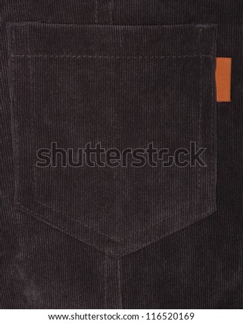 Fragment of jeans with pocket, Trouser pocket of brown corduroys.