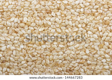 Close shot of sesame seeds, food background, sesame seeds in syrup, Sesame Seed Honey Bar