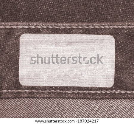 blank fabric label on brown jeans background, Useful for Your text